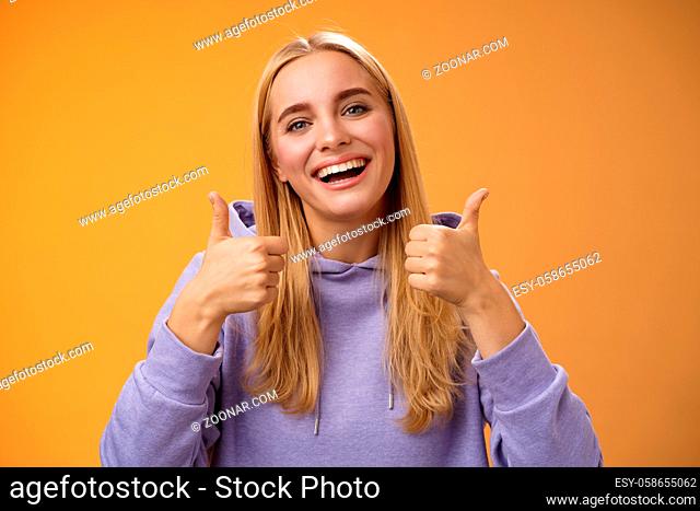 Lifestyle. Close-up charming delighted cute female customer give positive feedback show thumbs-up like gesture smiling broadly agree recommend perfect product...
