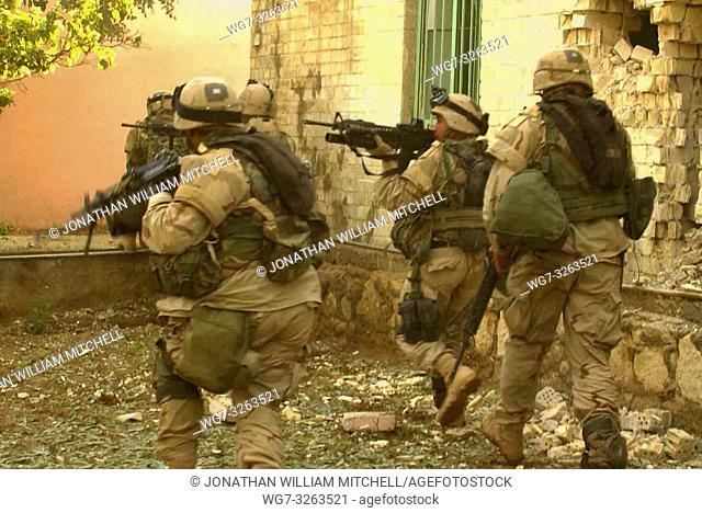 IRAQ Fallujah -- 09 Nov 2004 -- American soldiers from the 1st Platoon, Apache Troop, 2nd of the 5th Cavalry, 2nd BCT, 1st Cavalry Division storm and clear a...