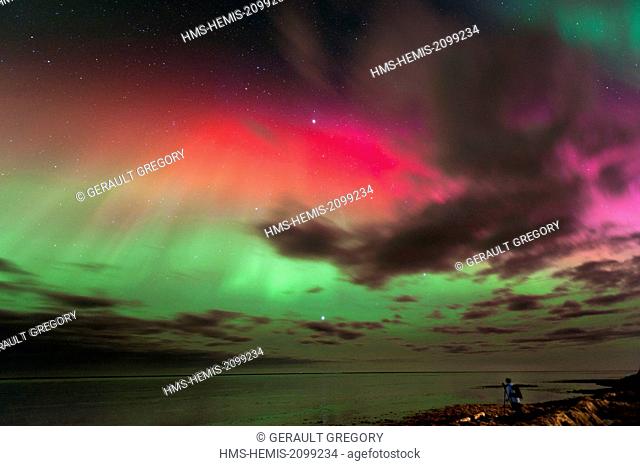 Iceland, Austurland, photographer under the Northern Lights