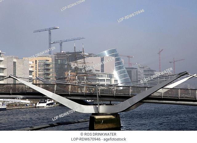 Republic of Ireland, Dublin, Dublin, The Millennium Bridge over the River Liffey in Dublin. The pedestrian bridge connects Temple Bar to the North Quays