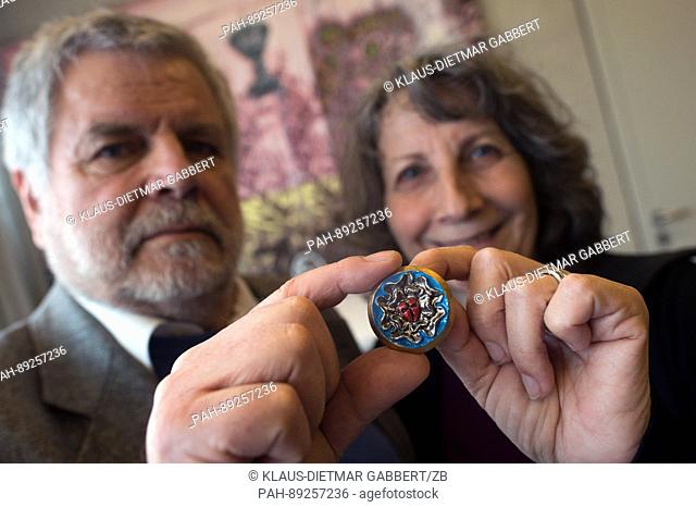 Frank Nonnenmacher, the son of the sculptor G. Nonnenmacher, and Ulrike Arnold-Nonnenmacher show a colored tin cast Luther rose at the museum ""Luther's last...