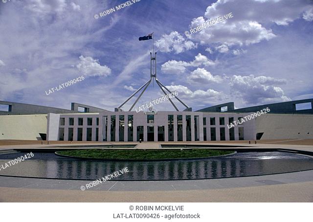 Parliament building. Lake. Flag