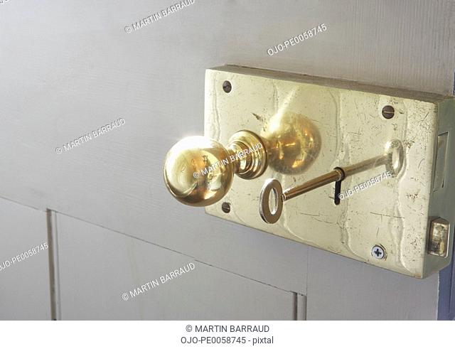 Doorknob and key in keyhole