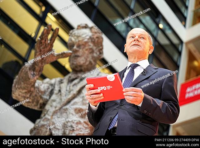 06 December 2021, Berlin: Germany's Chancellor-designate Olaf Scholz of the Social Democratic Party (SPD), speaks during the presentation of his ministers at...