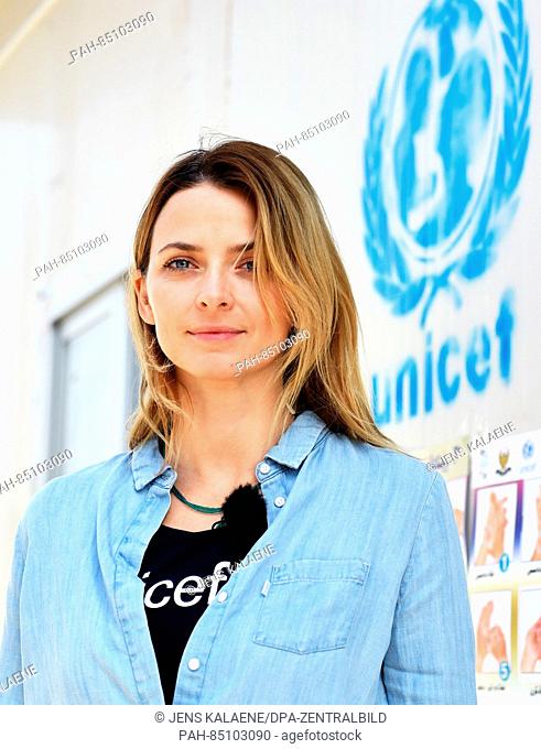 EXCLUSIVE - UNICEF ambassador Eva Padberg stands by a UNICEF logo at a school in the Dahuk region, Iraq, 19 October 2016