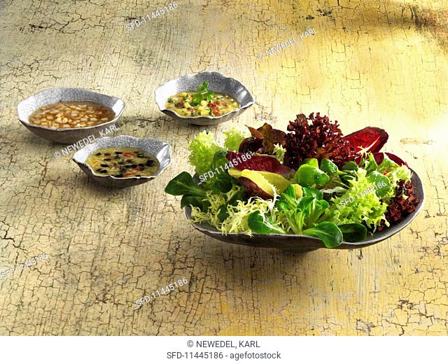 Three dressing for a winter salad: potato dressing, pear and walnut dressing, and a Parmesan dressing with olives and garlic