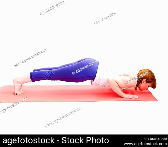 middle aged redhead woman exercising yoga isolated on white