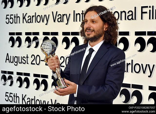 Serbian film director Stefan Arsenijevic poses after he received Crystal Globe award for film As Far as I Can Walk during award-giving closing ceremony of 55th...