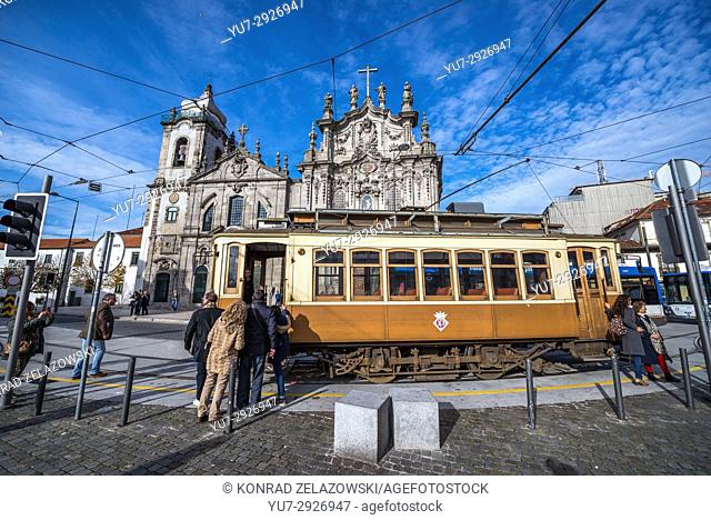 Vintage tram in front of Carmelite Church (Igreja dos Carmelitas Descalcos) and Carmo Church (Igreja do Carmo) in Vitoria parish of Porto, Portugal