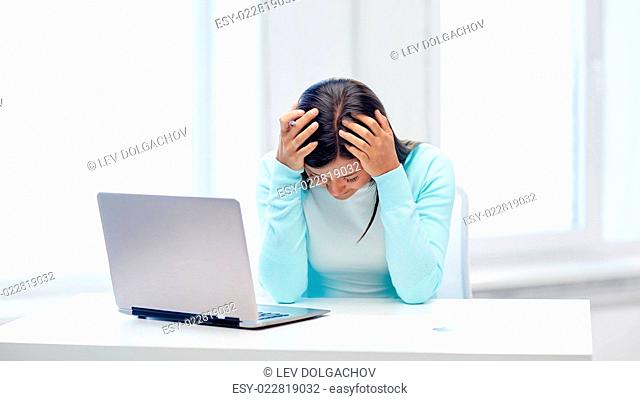 business, people, stress, fail and technology concept - despaired businesswoman with laptop computer and papers in office