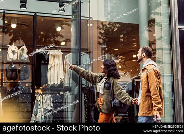 Couple looking at shop window