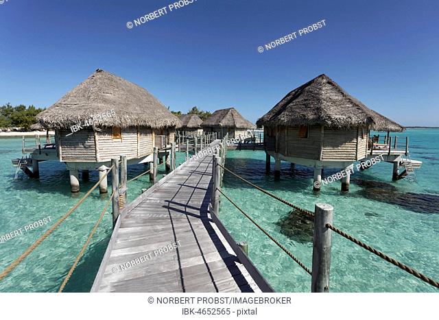 Bungalows, water bungalows at the pier in lagoon, Tikehau Pearl Beach Resort, Tikehau Atoll, Tuamotu Archipelago, Society Islands, Windward Islands