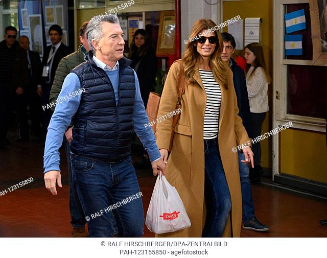 Mauricio Macri, President of Argentina, walks with his wife Juliana Awada in the presidential primary elections to a polling station in Buenos Aires
