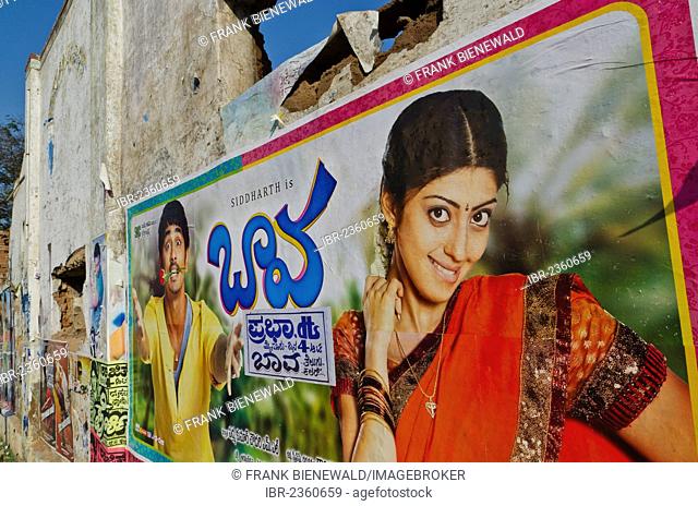 Cinema posters on wall of a broken down house, Mysore, India, Asia