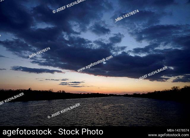Germany, Bavaria, Upper Bavaria, Altötting district, Neuötting, sunset at the Inn, dark clouds, windy