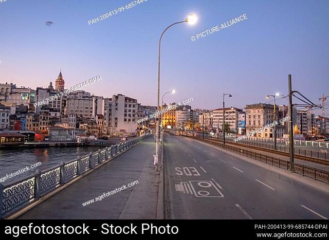 12 April 2020, Turkey, Istanbul: The Galata Bridge is deserted during the two-day curfew imposed by the Turkish government to halt the spread of the coronavirus