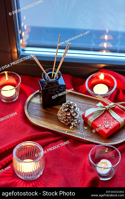 christmas gift, candles, reed diffuser on window