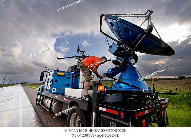 Doppler on Wheels driver Herb Stein ties down the radar dish near Des Moines, Iowa, June 5, 2010, after a storm chase  Herb and the DOW are participating in...