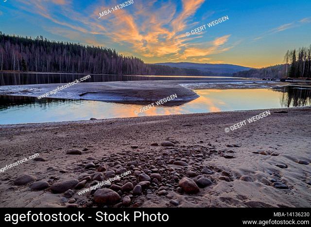 rocks and a river in a forest , mountain landscape with sunrise
