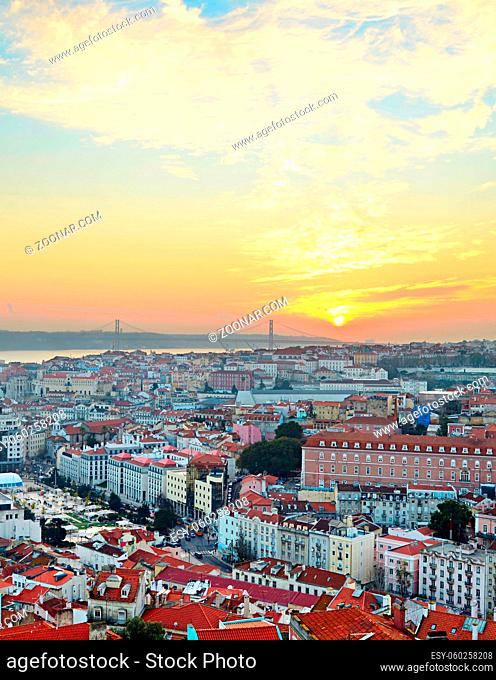 View of Lisbon city center and 25 April Bridge at sunset, Portugal