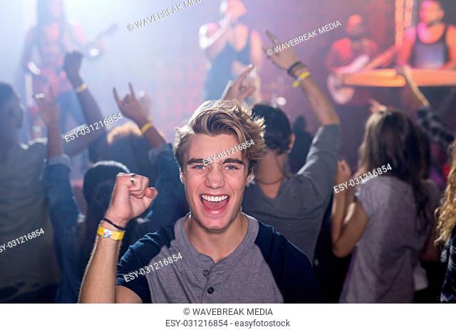 Portrait of happy man in nightclub