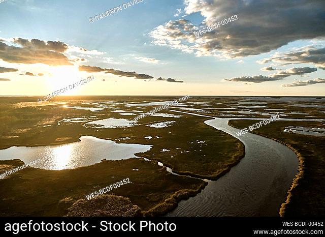 USA, Maryland, Drone view of marsh along Blackwater River at sunset
