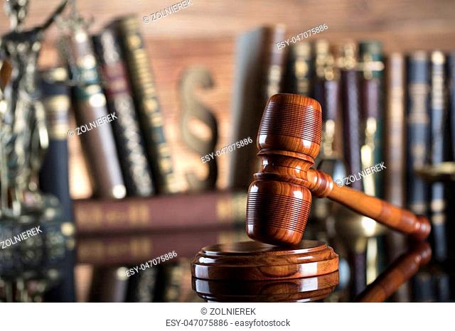Judge’s gavel and books on wooden background. Place for typography