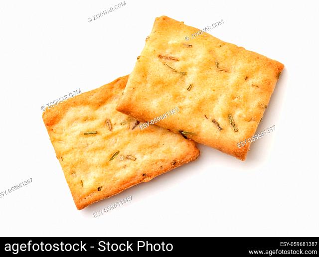 Top view of garlic, rosemary and sea salt crackers isolated on white