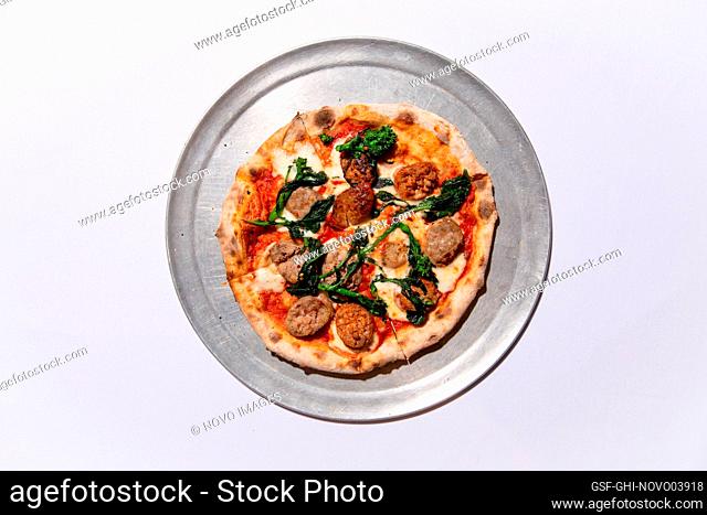High Angle View of Brick Oven Pizza with Sausage and Broccoli Raab