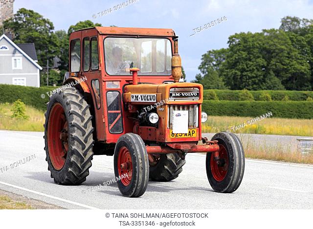 Kimito, Finland. July 6, 2019. Red Volvo BM 600 tractor on Kimito Tractorkavalkad, Tractor Cavalcade, yearly tractor parade