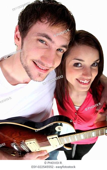 Young couple with an electric guitar