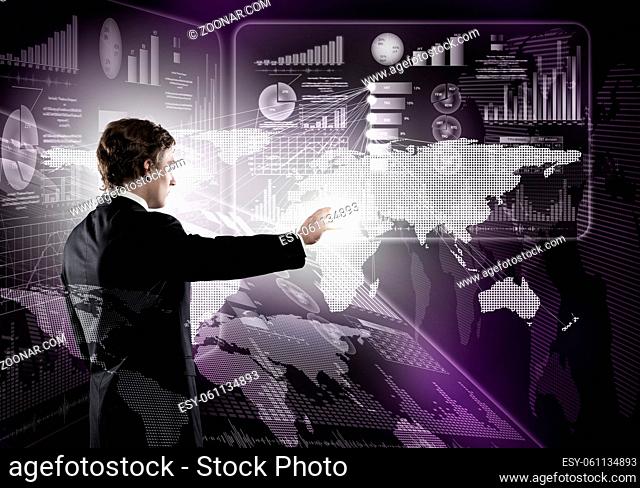 Young businessman working with modern virtual panel