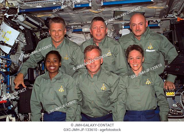 The STS-121 crewmembers gather for an in-flight crew photo in the Destiny laboratory of the International Space Station. From the left (bottom) are astronauts...
