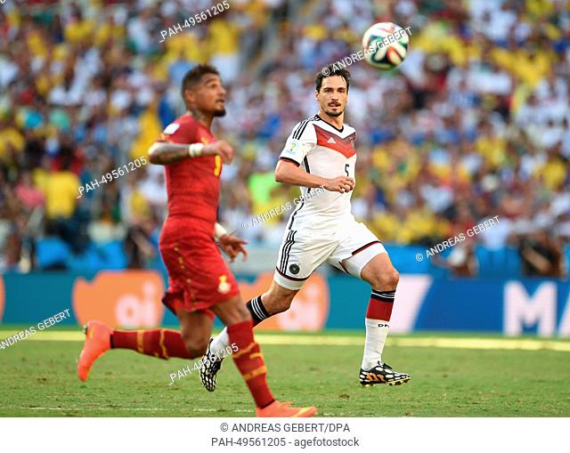 Ghana's Kevin Prince Boateng (L) and Germany's Mats Hummels vie for the ball during the FIFA World Cup 2014 group G preliminary round match between Germany and...