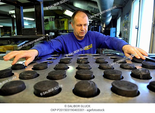 Pucks for the Ice Hockey World Championship are produced in Gufex company in Katerinice, Czech Republic, March 19, 2015. Czech National Ice Hockey Team will...