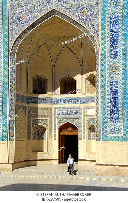 Muslim believer in the entrance (iwan) of Mosque Kalon Bukhara Uzbekistan