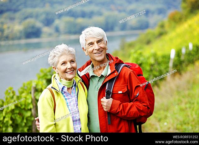 Germany, Rheingau, happy senior couple hiking