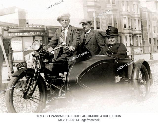 Two men and a lady on a 1914/15 small engined Enfield motorcycle & sidecar combination at the seaside circa 1915