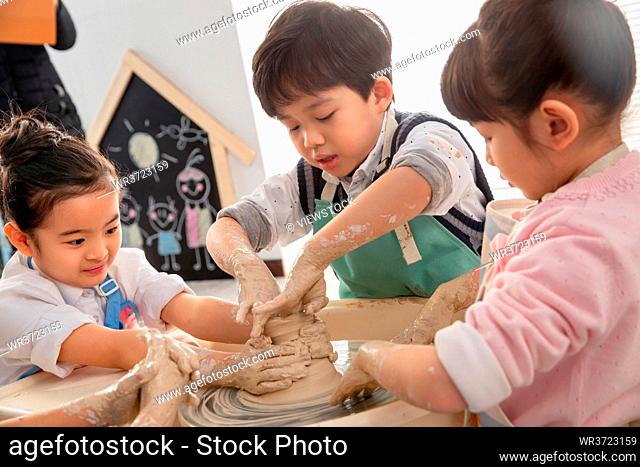 Happy children handmade pottery class