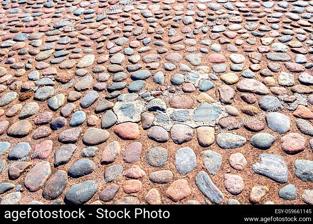 Old cobblestone pavement as creative background texture