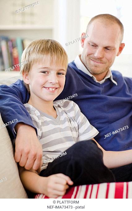 Father and son in a couch, Sweden
