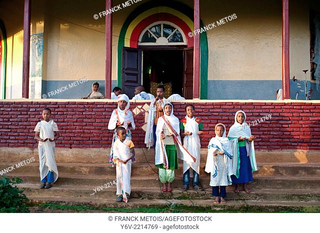 In front of a orthodox church, children are singing. Oromia state, Ethiopia