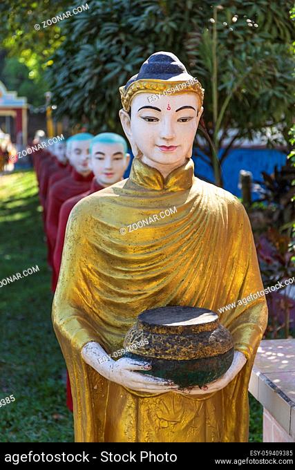 Long row of monk statues at Kaw Ka Thaung cave
