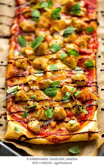 Puff pastry pizza topped with barbecue chicken