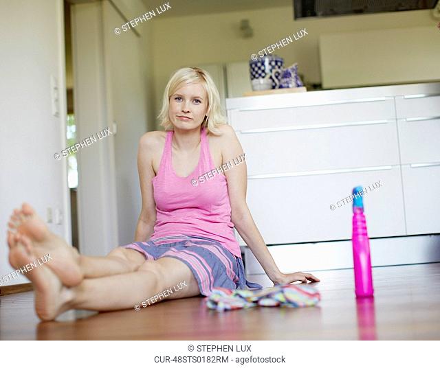Woman sitting on floor
