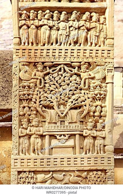 Close-up view showing stories of Buddha on upper panel south pillar front side of eastern gateway of stupa 1 , Sanchi near Bhopal , Madhya Pradesh , India