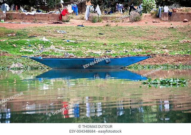 A blue pirogue on the river Niger