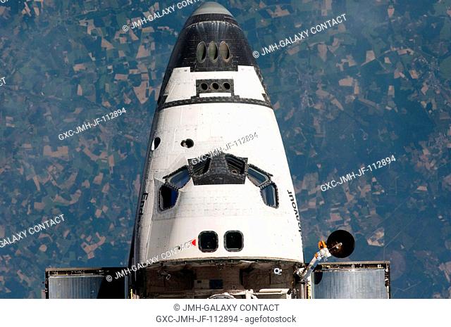 This view of the nose and crew cabin of the space shuttle Endeavour was provided by an Expedition 27 crew member during a survey of the approaching STS-134...