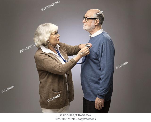 Senior woman checking heart beat