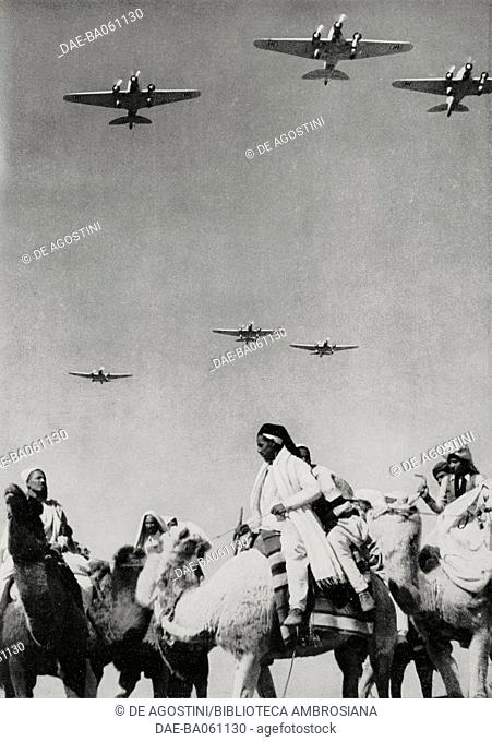 Italian aircrafts fly over some Arab men on camel-back in Italian East Africa, from L'Illustrazione Italiana, year LXIV, n 20, May 16, 1937